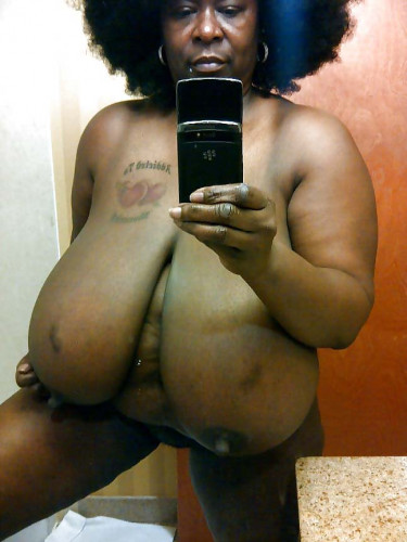 Black mature Busty Vanessa unveiling huge tits