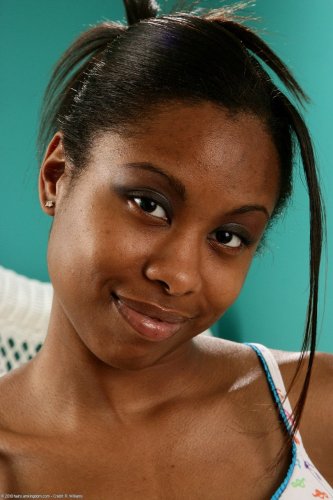 Ebony slut Carmel Kisses spreading legs