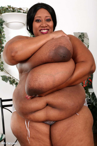 Black BBW Cotton Candi baring big boobs