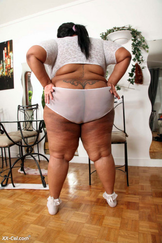 Black BBW Cotton Candi baring big boobs