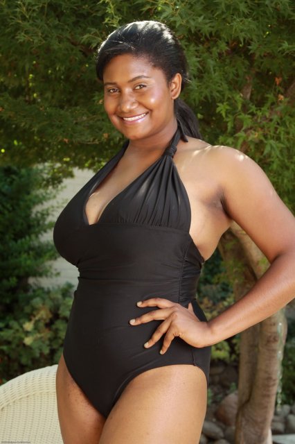 Black chubby teen Daphina getting naked