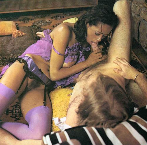 Ebony vintage Desiree West riding white cock