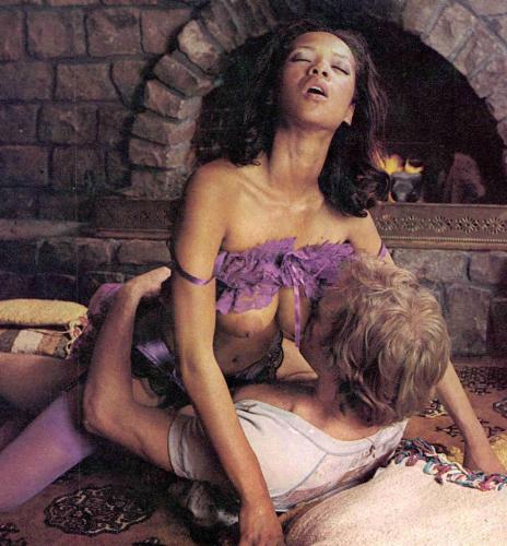 Ebony vintage Desiree West riding white cock