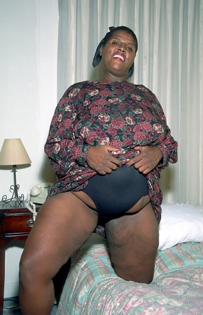 Black mature BBW Ervin Leland sucking white cock