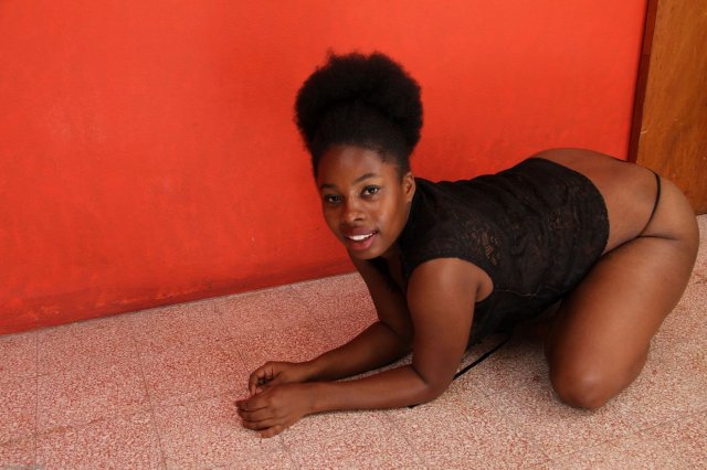 Black curvy Melanie stripping off