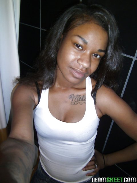 Ebony teen Millian Blaze baring black ass