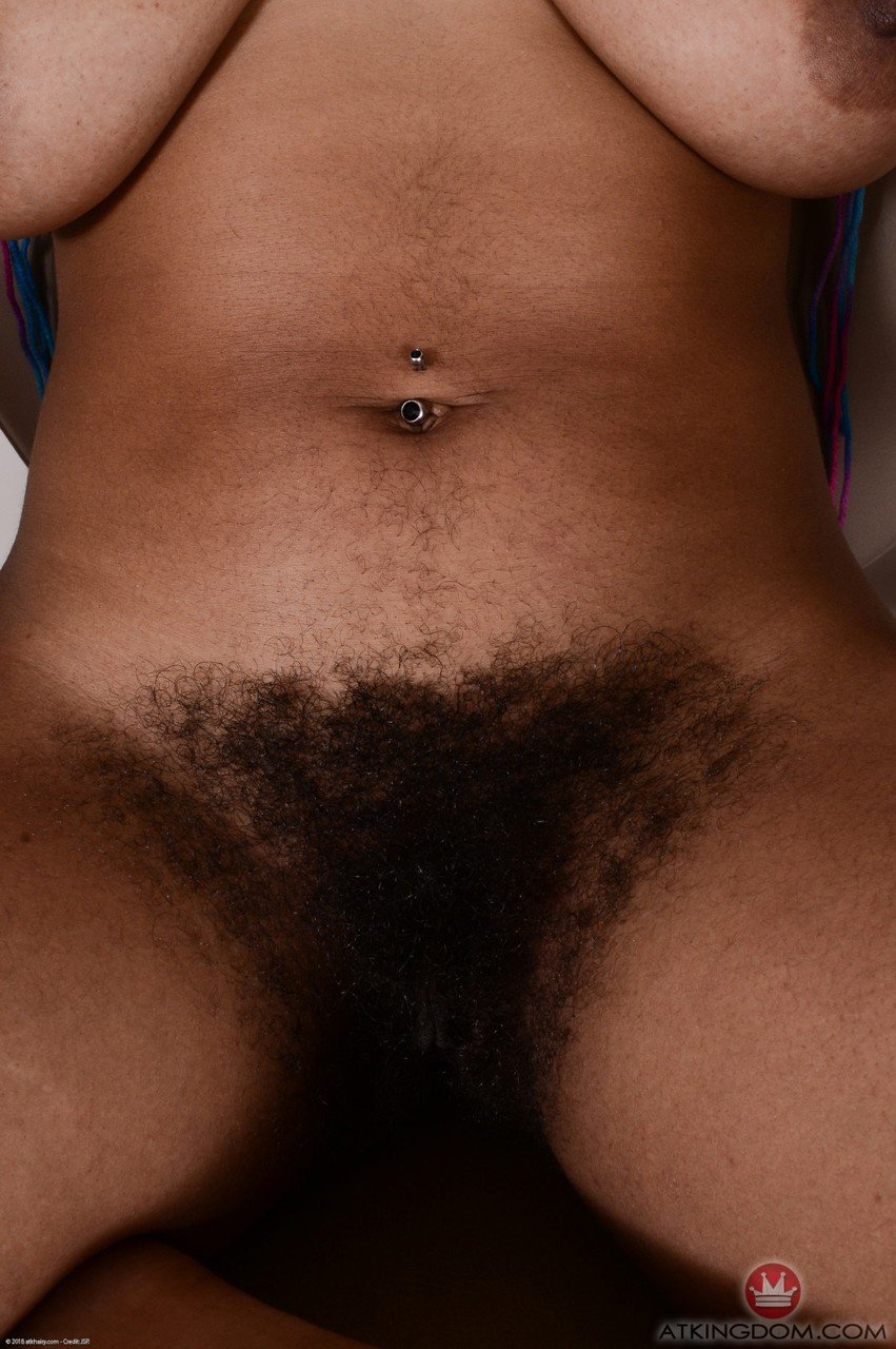 Ebony hairy diva Oya revealing her hairy pussy