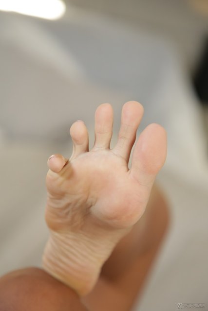 Black Romy Indy doing footjob for white cock