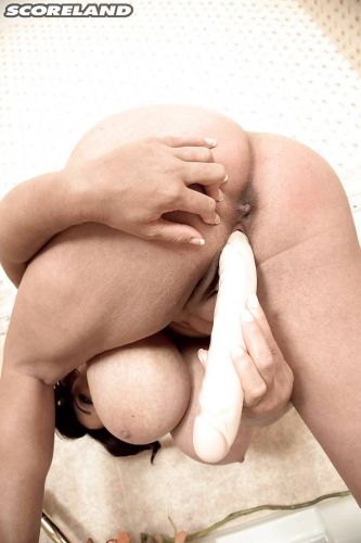 Busty Roxi Red baring her big tits